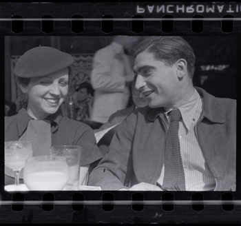 Fred Stein [Gerda Taro and Robert Capa on the Terrace of Cafe du Dome in Montparnasse, Paris], early 1936. Negative. Copyright Estate of Fred Stein, International Center of Photography.